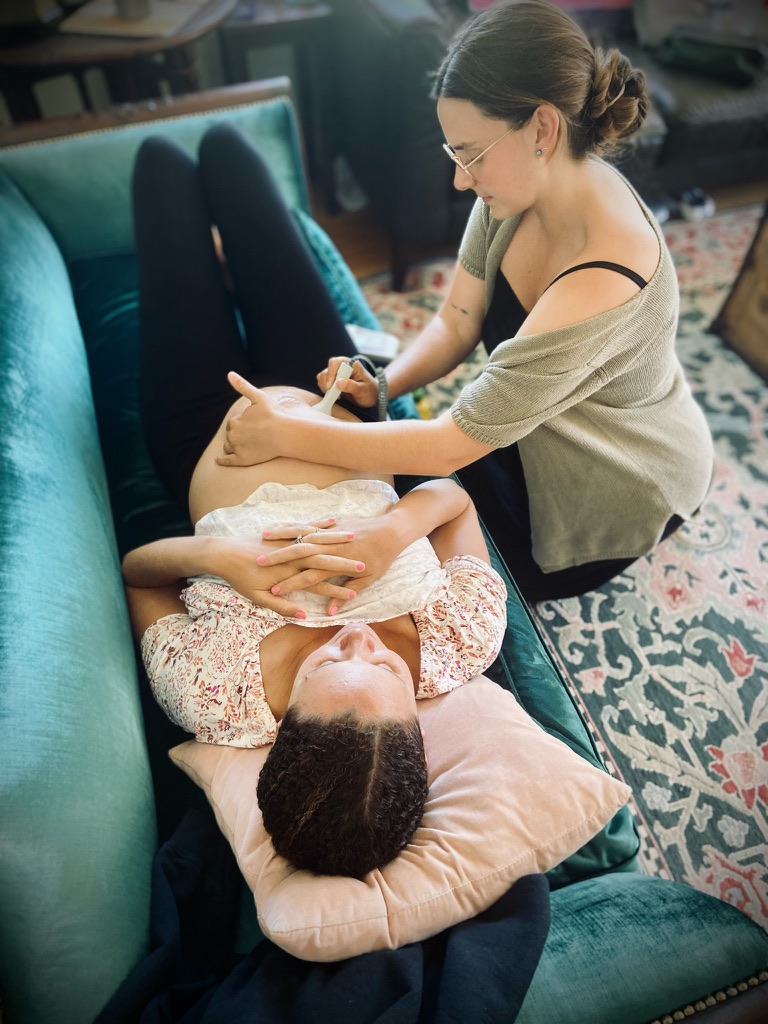 Homebirth midwife with a pregnant woman